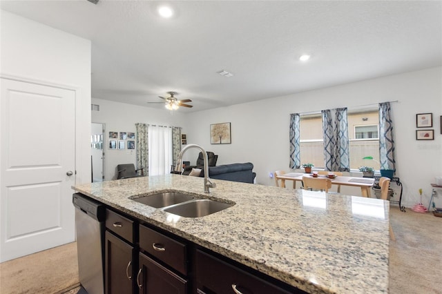 5816 Beefmaster Rd, Saint Cloud, FL 34771 - kitchen featuring a sink, dishwasher, light carpet, open floor plan, and light stone countertops