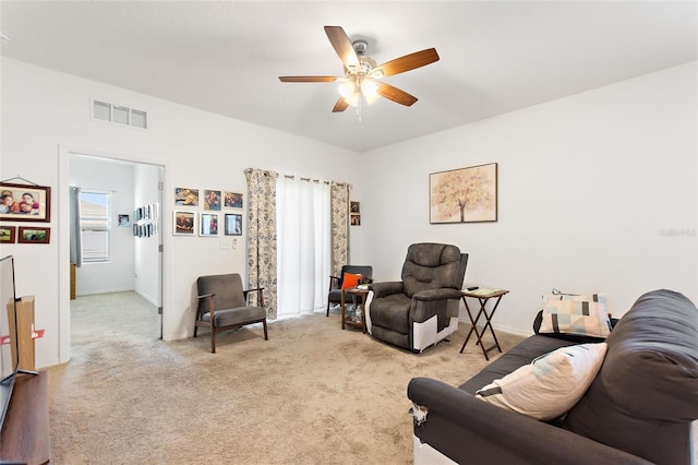 5816 Beefmaster Rd, Saint Cloud, FL 34771 - living area featuring a ceiling fan, light colored carpet, and baseboards