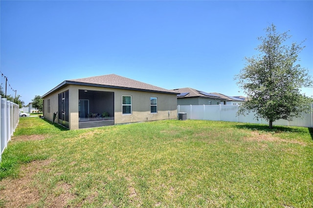 5816 Beefmaster Rd, Saint Cloud, FL 34771 - rear view of property featuring stucco siding, a sunroom, and cooling unit