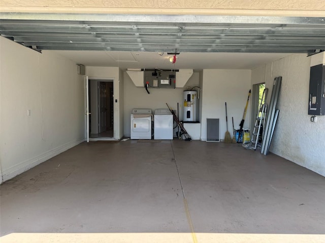 garage featuring washer and dryer, water heater, and electric panel