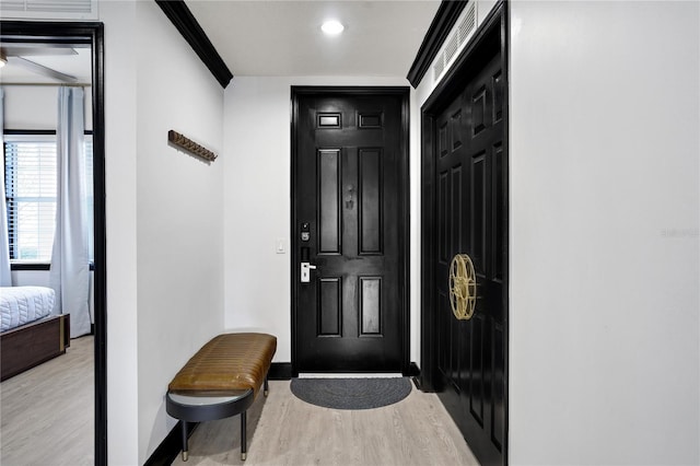 interior space featuring baseboards and wood finished floors
