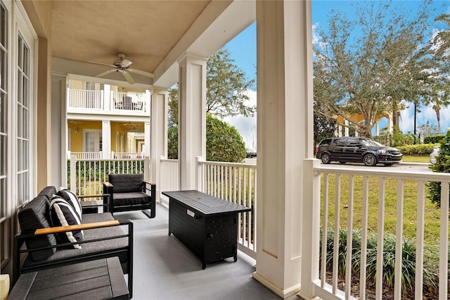 exterior space featuring covered porch and ceiling fan
