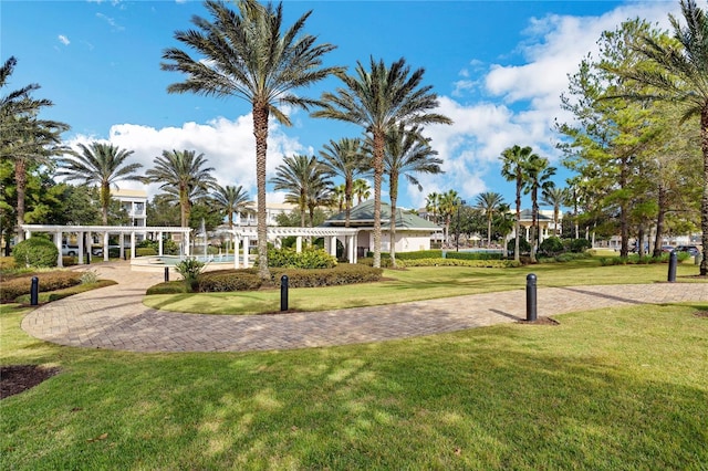 view of home's community with a lawn