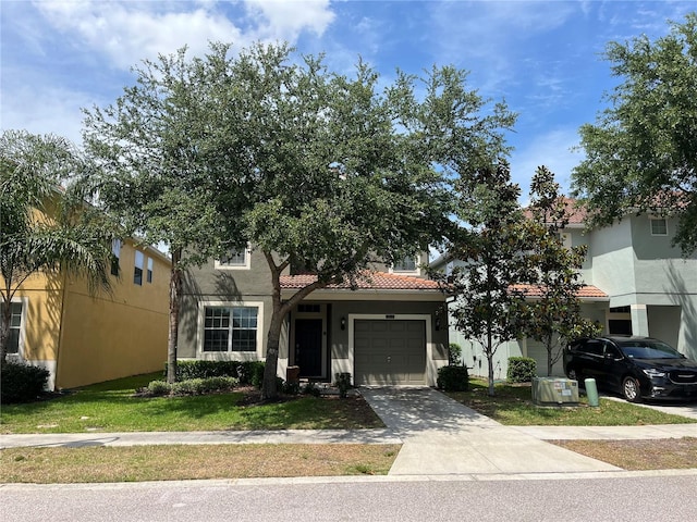 obstructed view of property featuring a tile roof, concrete driveway, a garage, stucco siding, and a front lawn