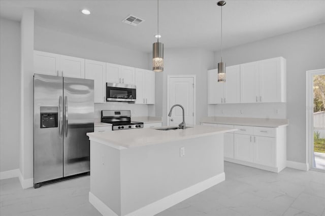 kitchen featuring a sink, white cabinetry, visible vents, appliances with stainless steel finishes, and marble finish floor