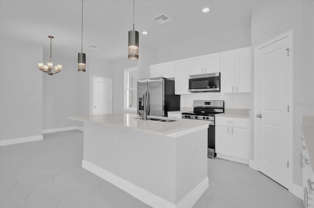kitchen with stainless steel appliances, a center island with sink, visible vents, white cabinetry, and marble finish floor
