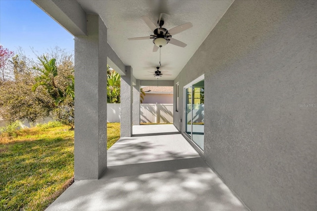 view of patio / terrace featuring a ceiling fan and fence