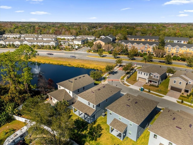 bird's eye view featuring a water view and a residential view