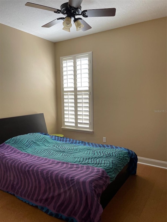 907 Pawstand Rd, Celebration, FL 34747 - bedroom featuring baseboards and ceiling fan