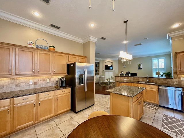 907 Pawstand Rd, Celebration, FL 34747 - kitchen featuring stainless steel appliances, ornamental molding, a chandelier, light tile patterned flooring, and a sink