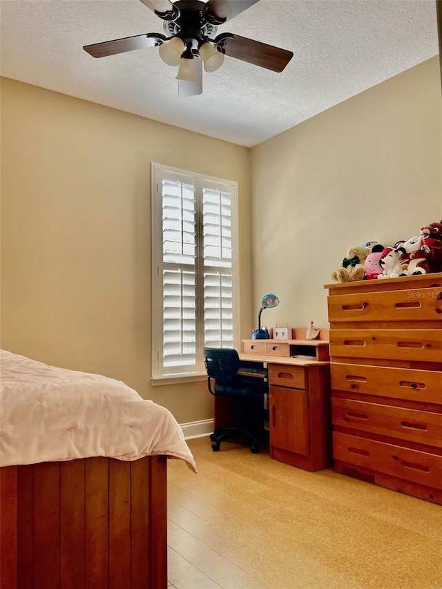 907 Pawstand Rd, Celebration, FL 34747 - bedroom featuring a textured ceiling, ceiling fan, and baseboards
