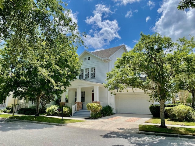 907 Pawstand Rd, Celebration, FL 34747 - view of front of house featuring driveway and a porch