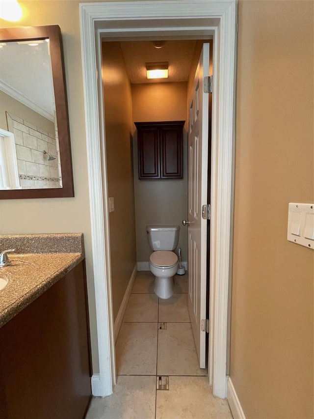 907 Pawstand Rd, Celebration, FL 34747 - bathroom featuring toilet, vanity, tile patterned floors, and baseboards