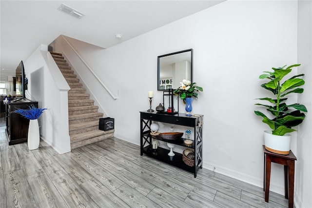 5424 Companion Ln, Tampa, FL 33619 - stairs with wood finished floors and baseboards