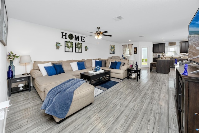 5424 Companion Ln, Tampa, FL 33619 - living room featuring a ceiling fan, light wood-style flooring, and recessed lighting