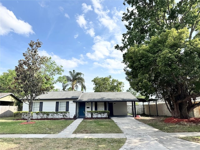 1098 Leeway Ct, Orlando, FL 32810 - single story home featuring fence, a front yard, concrete driveway, and an attached carport