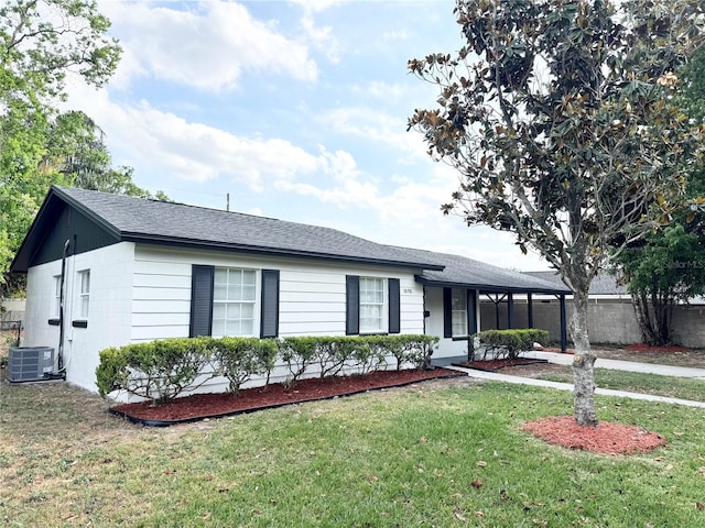 1098 Leeway Ct, Orlando, FL 32810 - ranch-style home with a front lawn, a shingled roof, fence, and central AC