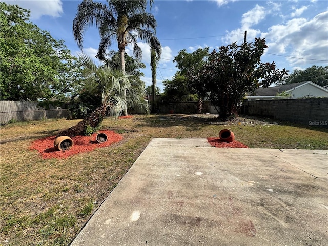 1098 Leeway Ct, Orlando, FL 32810 - view of yard with a patio and a fenced backyard