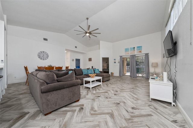 2902 Paddington Way, Kissimmee, FL 34747 - living area with high vaulted ceiling, a ceiling fan, and baseboards