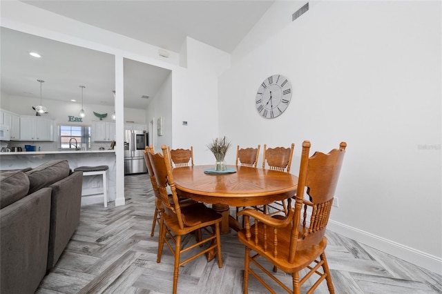 2902 Paddington Way, Kissimmee, FL 34747 - dining area featuring baseboards and recessed lighting