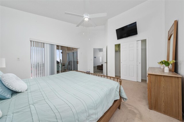 2902 Paddington Way, Kissimmee, FL 34747 - bedroom featuring light colored carpet, a closet, a high ceiling, and ceiling fan