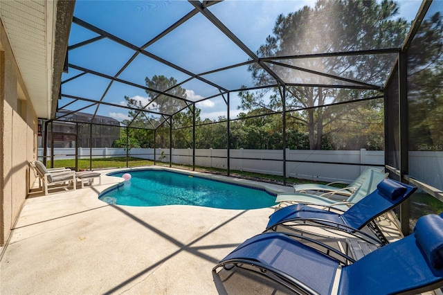 2902 Paddington Way, Kissimmee, FL 34747 - view of pool with a patio area, a fenced backyard, and glass enclosure