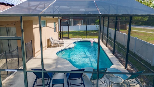 2902 Paddington Way, Kissimmee, FL 34747 - view of swimming pool with a patio area and glass enclosure