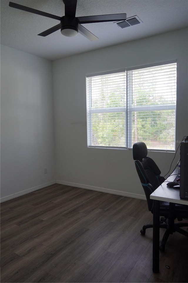 home office with ceiling fan, a wealth of natural light, baseboards, and dark wood-style floors