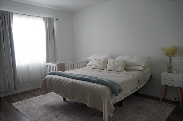 bedroom featuring wood finished floors