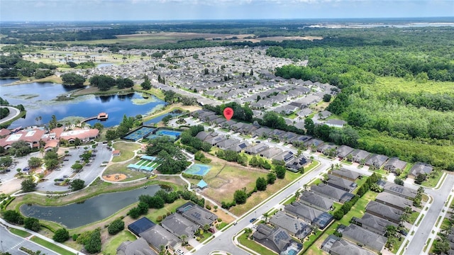 aerial overview of property's location featuring nearby suburban area and a nearby body of water