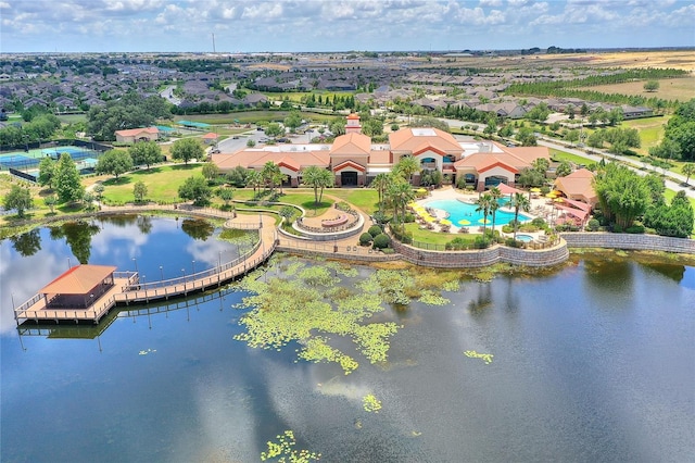bird's eye view of a pool area and a large body of water