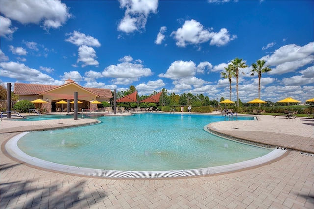 community pool with a patio area