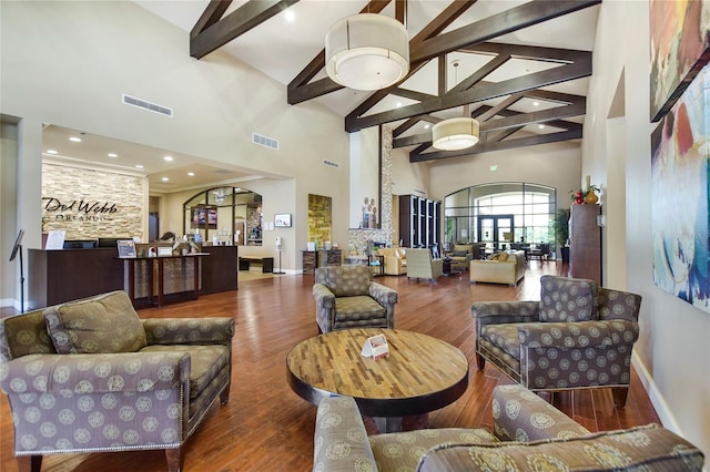 common area with high vaulted ceiling, beam ceiling, and recessed lighting