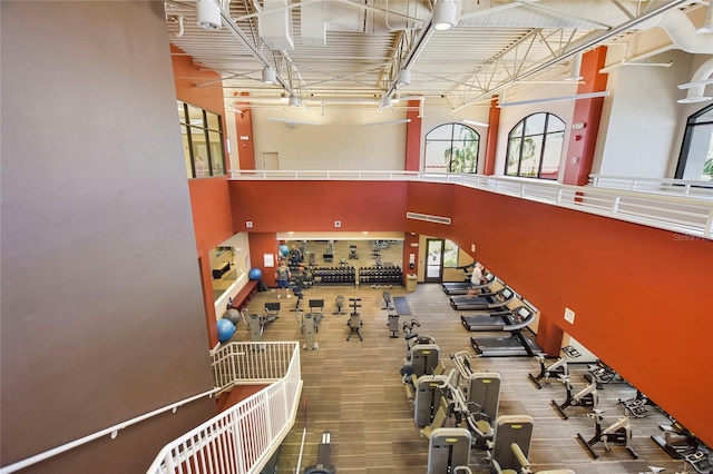 exercise room featuring a high ceiling