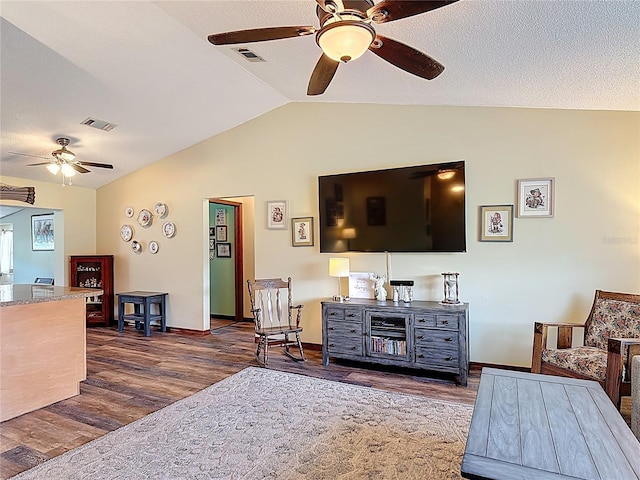 3110 Short Leaf Pine Ct, Kissimmee, FL 34746 - living area with ceiling fan, vaulted ceiling, dark wood-style floors, and baseboards