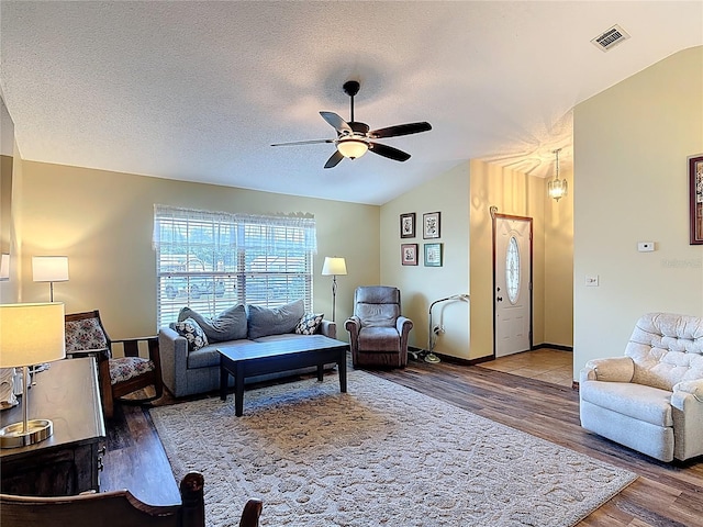 3110 Short Leaf Pine Ct, Kissimmee, FL 34746 - living room with lofted ceiling, wood finished floors, ceiling fan, a textured ceiling, and baseboards
