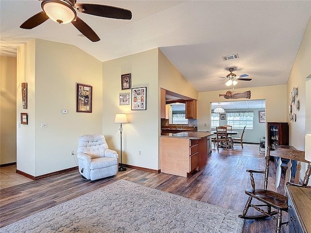 3110 Short Leaf Pine Ct, Kissimmee, FL 34746 - living area featuring a ceiling fan, lofted ceiling, dark wood finished floors, and baseboards