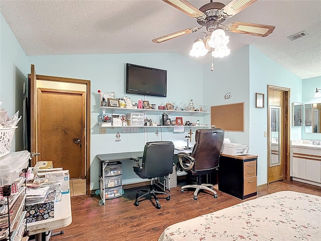 3110 Short Leaf Pine Ct, Kissimmee, FL 34746 - home office with lofted ceiling, ceiling fan, wood finished floors, a textured ceiling, and a sink