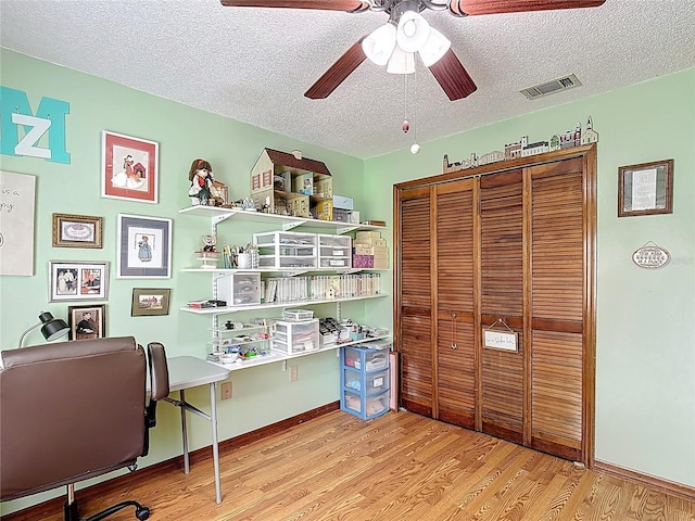3110 Short Leaf Pine Ct, Kissimmee, FL 34746 - office area with a ceiling fan, light wood-type flooring, a textured ceiling, and baseboards