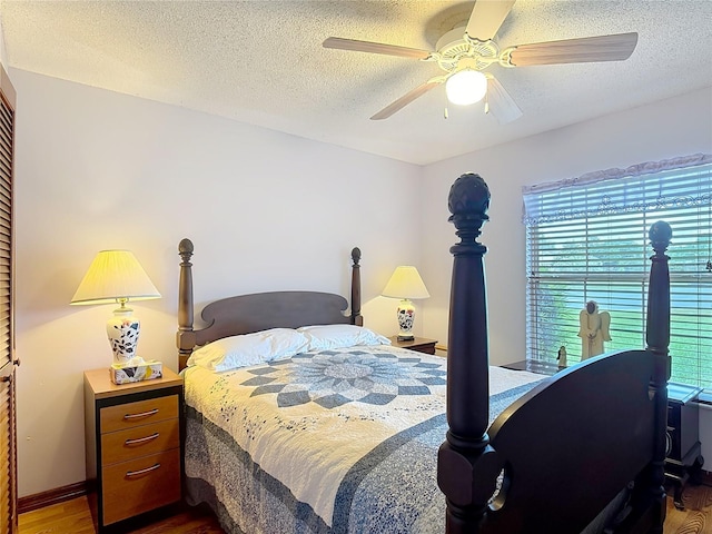 3110 Short Leaf Pine Ct, Kissimmee, FL 34746 - bedroom with wood finished floors, multiple windows, a textured ceiling, and a ceiling fan