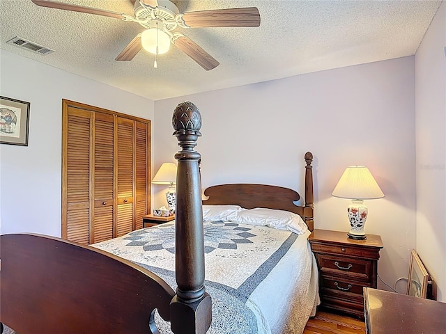 3110 Short Leaf Pine Ct, Kissimmee, FL 34746 - bedroom with a textured ceiling, ceiling fan, wood finished floors, and a closet