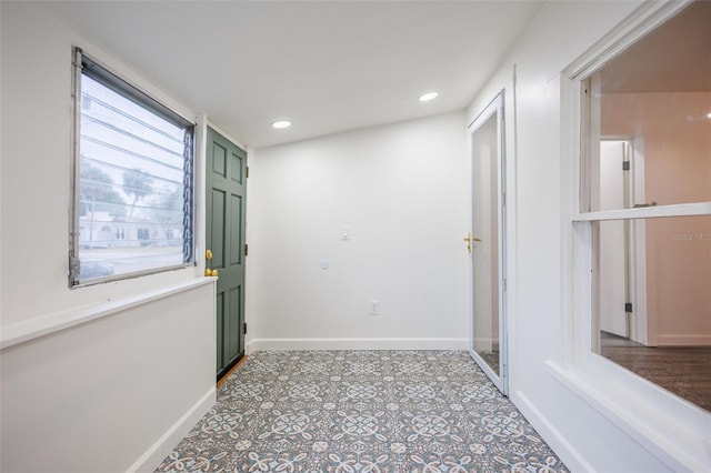 1007 11th St, Saint Cloud, FL 34769 - hallway with tile patterned flooring, baseboards, and recessed lighting