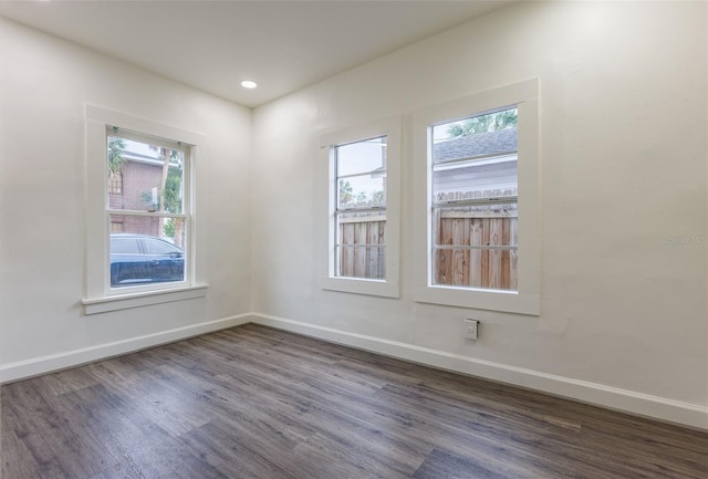 1007 11th St, Saint Cloud, FL 34769 - empty room featuring wood finished floors, baseboards, and recessed lighting