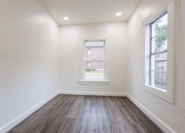 1007 11th St, Saint Cloud, FL 34769 - spare room with wood finished floors, baseboards, and recessed lighting