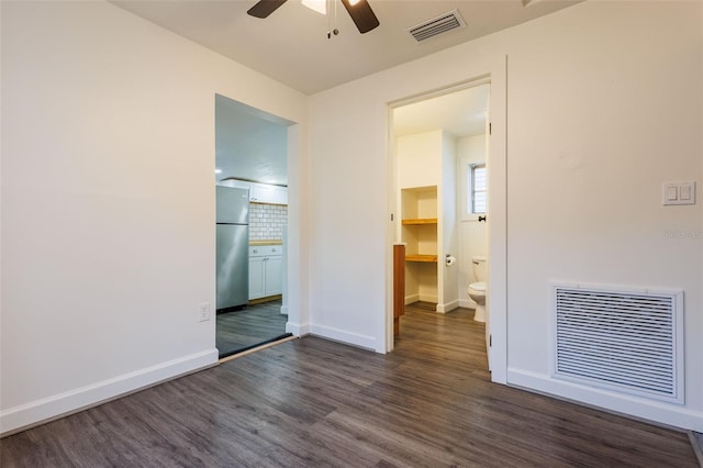 1007 11th St, Saint Cloud, FL 34769 - empty room featuring ceiling fan, baseboards, visible vents, and dark wood finished floors