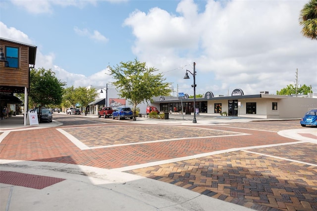 1007 11th St, Saint Cloud, FL 34769 - view of road featuring curbs, sidewalks, and street lights
