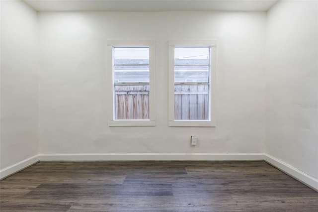 1007 11th St, Saint Cloud, FL 34769 - spare room featuring wood finished floors and baseboards