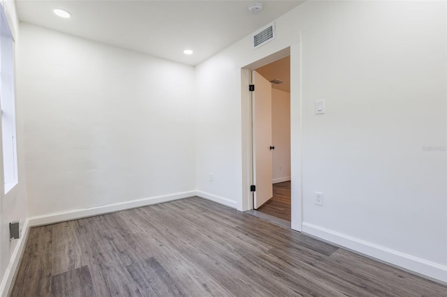 1007 11th St, Saint Cloud, FL 34769 - empty room featuring visible vents, wood finished floors, and baseboards