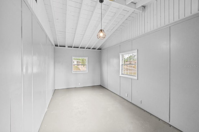 4445 Stuart Ave, Titusville, FL 32780 - unfurnished room featuring lofted ceiling and finished concrete floors