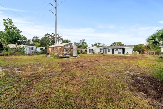 4445 Stuart Ave, Titusville, FL 32780 - view of yard with an outdoor structure and a storage shed